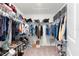 Organized walk-in closet with ample storage for clothing, shoes, and accessories at 12481 Aston Dr, Hudson, FL 34669