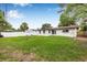 Spacious backyard with lush green grass and a charming white fence at 1349 Tyrone N Blvd, St Petersburg, FL 33710