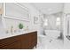 Modern bathroom showcasing a double sink vanity, soaking tub, and luxurious shower at 1349 Tyrone N Blvd, St Petersburg, FL 33710