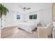 Inviting bedroom with plush bedding, ample natural light, and modern ceiling fan at 1349 Tyrone N Blvd, St Petersburg, FL 33710