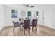 Dining area with modern table and seating, bathed in natural light at 1349 Tyrone N Blvd, St Petersburg, FL 33710