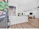 Bright entryway showcases open-concept living with modern flooring and inviting decor; perfect for entertaining at 1349 Tyrone N Blvd, St Petersburg, FL 33710