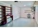 Spacious garage with storage shelving, utility sink, and neutral color palette at 1349 Tyrone N Blvd, St Petersburg, FL 33710