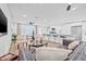 Open floor plan with living room, kitchen, and bar seating at 1349 Tyrone N Blvd, St Petersburg, FL 33710