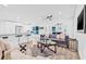 Open concept living area with modern furnishings and a view of the kitchen at 1349 Tyrone N Blvd, St Petersburg, FL 33710