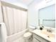 Freshly maintained bathroom with a shower-tub combo, updated vanity, and crisp, neutral decor at 13926 Mission Oaks Blvd, Seminole, FL 33776