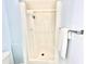 Clean bathroom features a stand-up shower and a white towel hung on a metal rack at 13926 Mission Oaks Blvd, Seminole, FL 33776