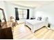 Inviting bedroom with a comfortable bed, soft lighting, and light-colored walls for a relaxing retreat at 13926 Mission Oaks Blvd, Seminole, FL 33776