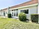 Welcoming home exterior with lush greenery and a well-maintained lawn at 13926 Mission Oaks Blvd, Seminole, FL 33776