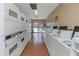 Bright laundry room with rows of washers and dryers for resident use at 13926 Mission Oaks Blvd, Seminole, FL 33776