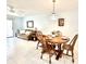 Open concept living space featuring a dining area, comfortable seating, and bright, neutral decor at 13926 Mission Oaks Blvd, Seminole, FL 33776