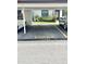 Assigned covered parking spot located near the property with the unit number marked in yellow paint at 13926 Mission Oaks Blvd, Seminole, FL 33776