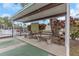 Covered shuffleboard area with benches for relaxing and enjoying the game at 13926 Mission Oaks Blvd, Seminole, FL 33776