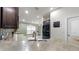 Bright kitchen featuring stainless steel sink, faucet, and appliances, as well as stone countertops at 14224 Edinburgh Moor Dr, Wimauma, FL 33598