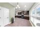 This kitchen features dark wood cabinets, recessed lighting, tiled floor, and stainless steel appliances at 14224 Edinburgh Moor Dr, Wimauma, FL 33598