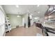 Spacious eat-in kitchen with dark cabinets, stainless steel appliances, and tile flooring at 14224 Edinburgh Moor Dr, Wimauma, FL 33598
