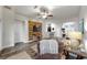Spacious living room with modern decor, a decorative wood wall, and an open layout connecting to the kitchen at 14224 Edinburgh Moor Dr, Wimauma, FL 33598