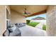 Relaxing covered patio with comfortable seating, perfect for enjoying the outdoor view at 14224 Edinburgh Moor Dr, Wimauma, FL 33598