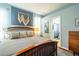 This bedroom offers a calming retreat with soft colors and an en-suite bathroom, perfect for relaxation at 14320 Tree Swallow Way, Lakewood Ranch, FL 34202