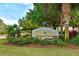 Community sign for Adventure Park with stone accents and lush tropical landscaping at 14320 Tree Swallow Way, Lakewood Ranch, FL 34202
