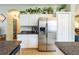 Kitchen featuring stainless steel appliances, white cabinets, and granite countertops at 14320 Tree Swallow Way, Lakewood Ranch, FL 34202