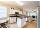 Modern kitchen featuring stainless steel appliances, white cabinets, and granite countertops at 14320 Tree Swallow Way, Lakewood Ranch, FL 34202