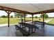 Covered picnic shelter with metal tables, providing a relaxing outdoor gathering space at 14320 Tree Swallow Way, Lakewood Ranch, FL 34202