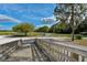 View from a wooden bridge of the open recreation area featuring a path, trees and greenery at 14320 Tree Swallow Way, Lakewood Ranch, FL 34202