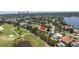 Aerial view of home near a golf course with beautiful landscaping and waterfront views at 167 Almedo Ne Way, St Petersburg, FL 33704