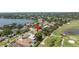 A lakeside house located close to the golf course has mature trees and landscaping to give privacy at 167 Almedo Ne Way, St Petersburg, FL 33704