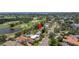 Aerial view of the property with a nearby golf course, landscaping, and waterfront views at 167 Almedo Ne Way, St Petersburg, FL 33704