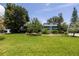 A charming single-story home boasting a lush green lawn and mature trees at 167 Almedo Ne Way, St Petersburg, FL 33704