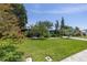A charming single-story home boasting a lush green lawn and mature trees at 167 Almedo Ne Way, St Petersburg, FL 33704