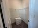 Walk-in closet with shelving and a small chest of drawers for organized storage solutions at 17304 Scuba Crest St, Wimauma, FL 33598