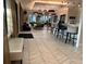 A stylish clubhouse area with sleek furniture, elegant bar, and modern design, perfect for socializing and relaxation at 17304 Scuba Crest St, Wimauma, FL 33598