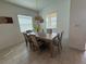 Dining area with wood table, seating for six, and pendant lighting at 17304 Scuba Crest St, Wimauma, FL 33598