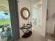 Inviting entryway with stylish decor and a view to the outdoor living space at 17304 Scuba Crest St, Wimauma, FL 33598