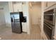 Modern kitchen featuring stainless steel appliances, white cabinets, and tiled flooring at 17304 Scuba Crest St, Wimauma, FL 33598