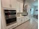 Updated kitchen featuring stainless steel double ovens and a gas range at 17304 Scuba Crest St, Wimauma, FL 33598