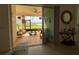 Relaxing lanai featuring comfortable seating, plants, and water view at 17304 Scuba Crest St, Wimauma, FL 33598