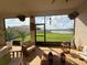 Tranquil lanai with comfortable seating, providing serene water views and a relaxing atmosphere at 17304 Scuba Crest St, Wimauma, FL 33598