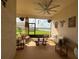 Enjoy the spacious lanai, complete with furniture and a serene lake view at 17304 Scuba Crest St, Wimauma, FL 33598
