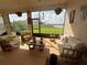 Beautiful outdoor lanai with comfortable seating and scenic water views at 17304 Scuba Crest St, Wimauma, FL 33598