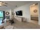 Cozy living room featuring modern decor, a sleek TV, and bright natural light at 17304 Scuba Crest St, Wimauma, FL 33598
