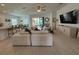Open concept living room flows to dining, kitchen and outdoor living spaces at 17304 Scuba Crest St, Wimauma, FL 33598