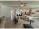 Open-concept living area with tile flooring, comfortable seating, flows well at 17304 Scuba Crest St, Wimauma, FL 33598
