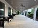 Covered patio features sleek modern furniture and plenty of room for outdoor activities at 17304 Scuba Crest St, Wimauma, FL 33598