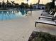 Pool with clear water, pool furniture, and landscaping at 17304 Scuba Crest St, Wimauma, FL 33598
