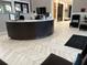 Stylish reception area with a sleek desk, modern flooring, and comfortable seating, creating an inviting atmosphere at 17304 Scuba Crest St, Wimauma, FL 33598