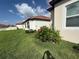 Well-maintained sideyard with manicured landscaping and vibrant flowers at 17304 Scuba Crest St, Wimauma, FL 33598